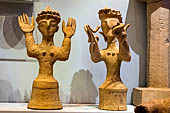 Goddesses with upraised arms and one with snakes. . Kani, Gortys. 1300-1200 BC. Archaeological museum of Heraklion.